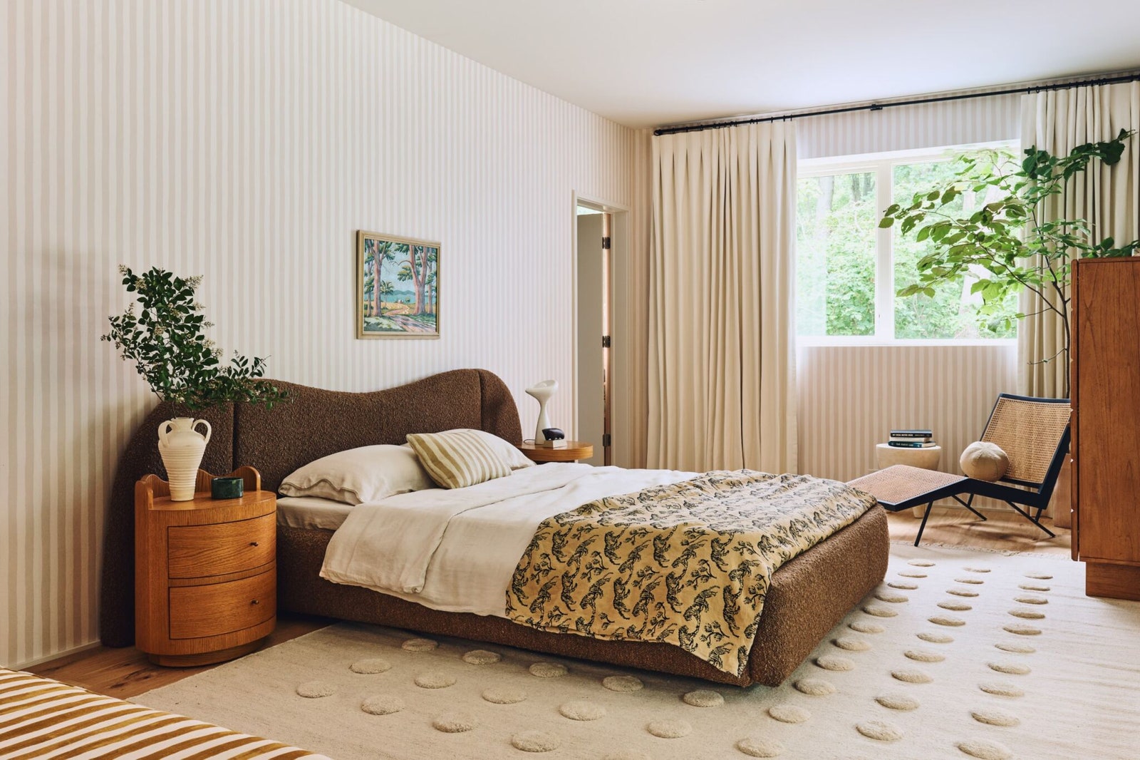 A bedroom pulls in Sherman Samuels Gladys Extended Headboard Platform Bed and Ripple Nightstand.