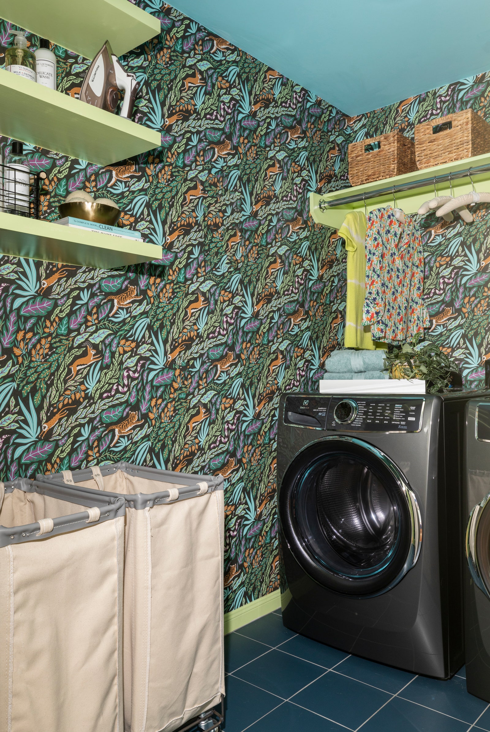 Green trim and shelving infuses personality into this small space.