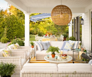 “This is their main hub for entertaining” shares Okin of the homeowners poolside loggia. The Serena and Lily whitewicker...