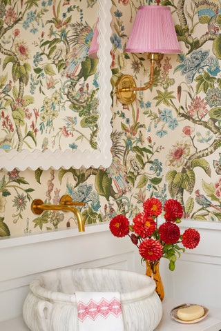 In the powder room the Cranley Garden wallpaper from Schumacher provides an immersive transportive quality. “It felt...