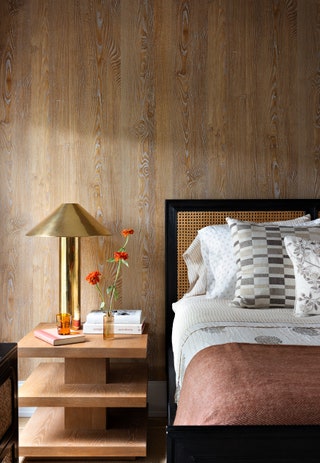 In another guest room which also functions as a study for the homeowners three sons Okin struck a more subdued tone....