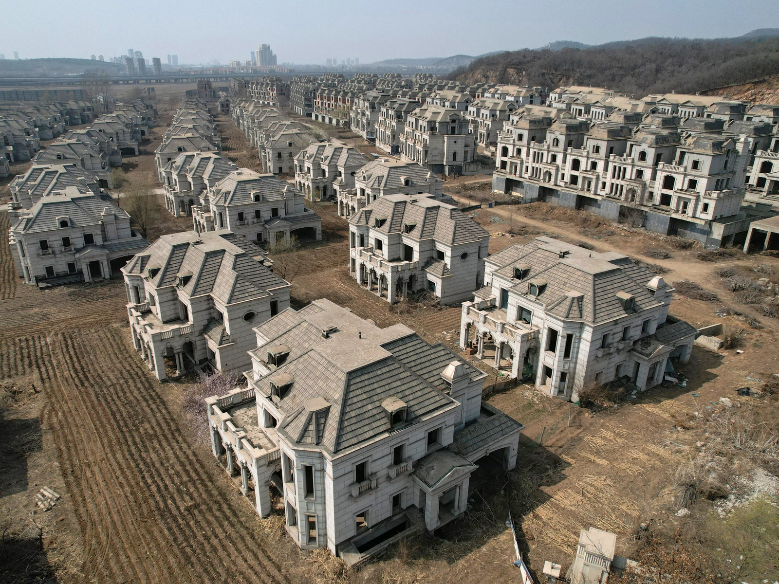 See Inside a Ghost Town of Abandoned Mansions in China