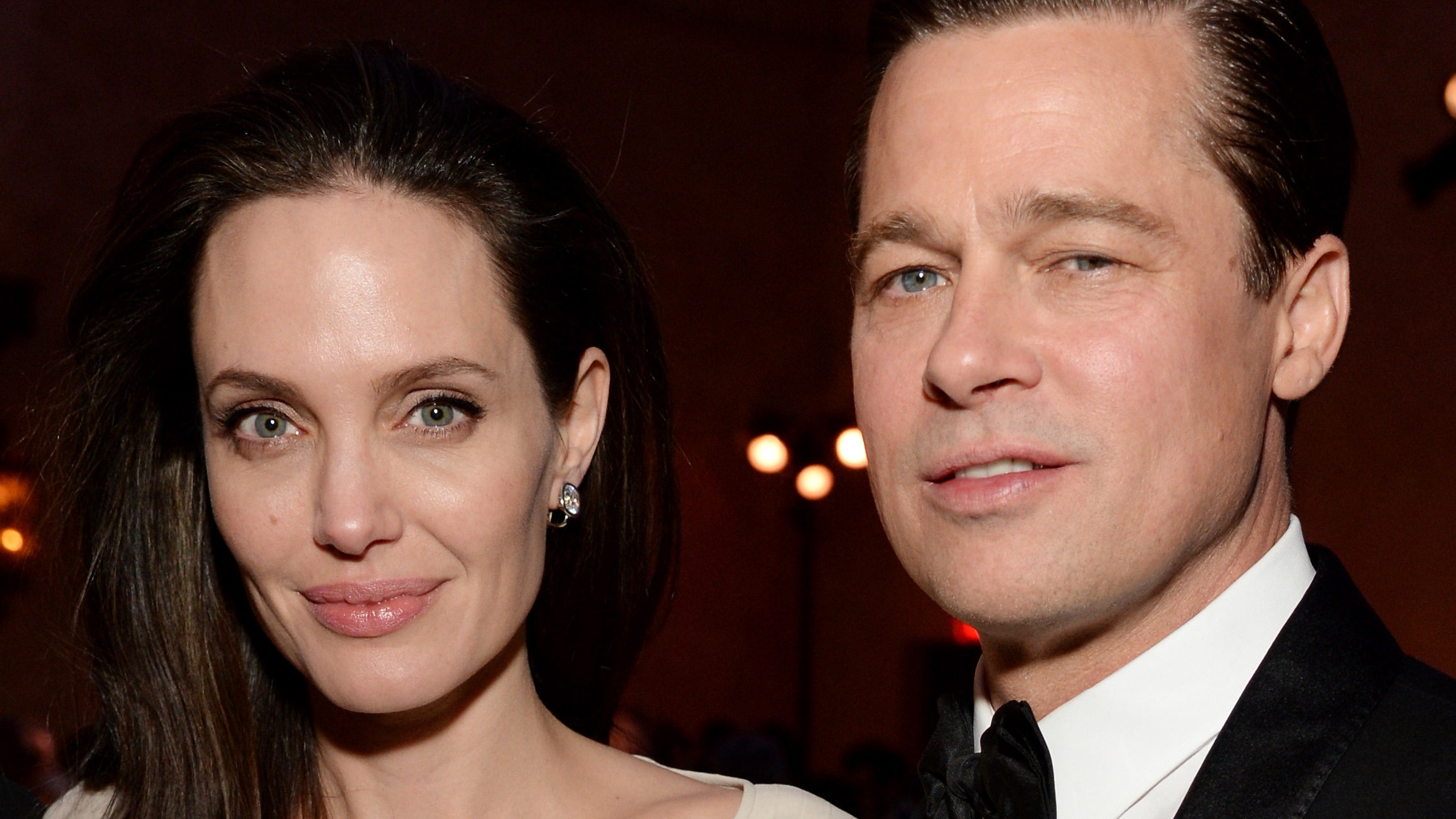 Angelina Jolie and Brad Pitt smiling