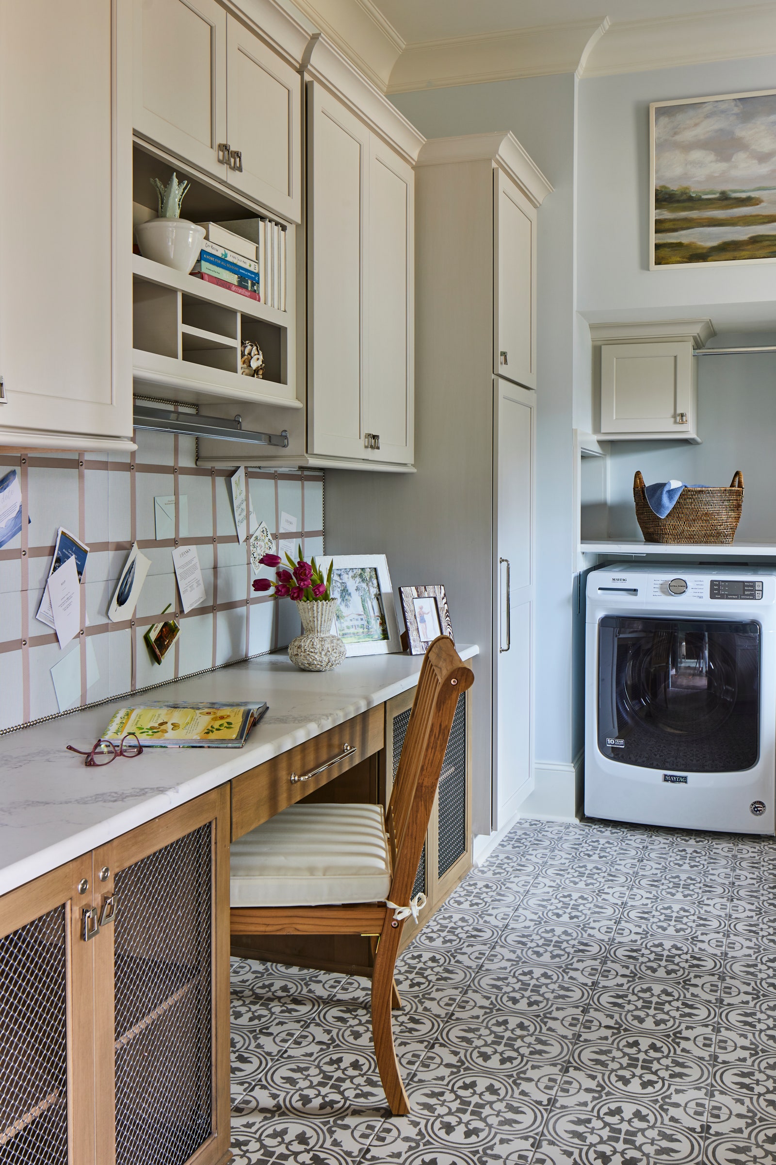 Its easy to work while clothes get cleaned in this laundry room.